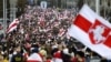 BELARUS – Protesters with old Belarusian national flags march during an opposition supporters rally in Minsk, September 6, 2020